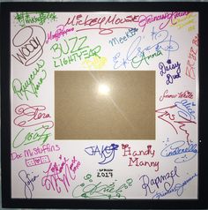 a white frame with many different colored writing on it