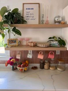 a kitchen counter with pots, pans and other items sitting on top of it