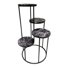 three tiered black and white marble side table with metal legs, on an isolated white background