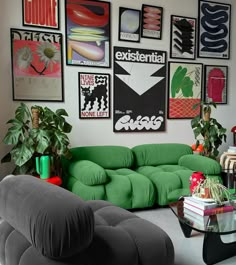 a living room filled with lots of green furniture