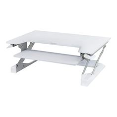 a white computer desk sitting on top of a table