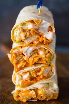 three burritos stacked on top of each other with cheese and meat in them