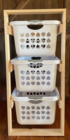 three plastic laundry baskets stacked on top of each other