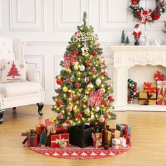 a decorated christmas tree in a living room with presents on the floor next to it