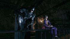 two men dressed up as batman and joker in the dark knight movie, sitting on a railing