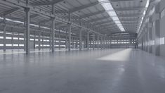 an empty warehouse with lots of windows and metal beams on the ceiling is shown in black and white