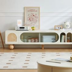 a living room with white walls and furniture