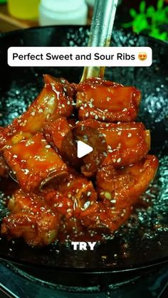 some food is cooking in a frying pan with chopsticks sticking out of it