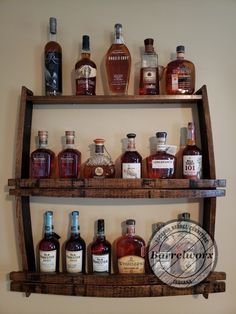 an old wooden shelf with liquor bottles on it