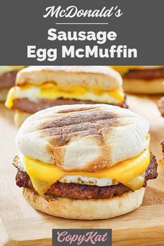 breakfast sandwiches with bacon, egg and cheese on a cutting board ready to be eaten