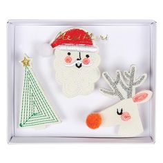 three felt christmas decorations in a box