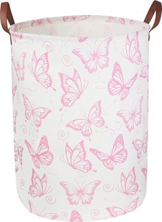 a pink and white laundry basket with butterflies on it