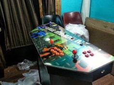 a table that is sitting in the middle of a room with some toys on it