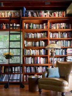 a living room filled with lots of books