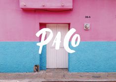 a pink and blue building with the word pao painted on it