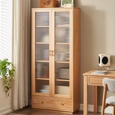 a wooden cabinet sitting next to a window