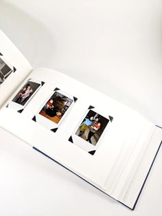 an open book with photos on it