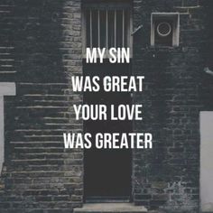 a brick building with the words my sin was great your love was greater