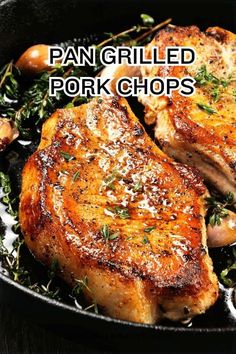 pan grilled pork chops in a skillet with herbs