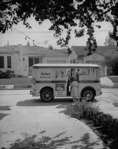 a black and white photo of a food truck