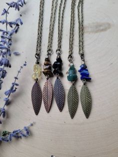 "This Leaf and Crystal Necklace makes a beautiful addition to any boho outfit. Choose from natural stones including yellow citrine, brown tigers eye, black obsidian, blue lapis lazuli, or green jade.   Each Necklace features an elegant antique brass or bronze-colored leaf charm hanging from your choice of a 16\" - 28\" antique brass colored chain.   The drop length of the leaf and Crystal pendant measures approximately 2 inches. The leaf necklace closes with an antique brass lobster claw.    Don't see a color you like? Please contact me and I will customize something to fit your exact taste! Please like my page on Facebook: https://www.facebook.com/HempClub I created Hemp Club Handmade Jewelry in memory of my best friend Julie Elizabeth Berls, who passed away December 31st 2011. She was a Witchy Products, Natural Crafts, Boho Leaves, Brown Tiger Eye, Hemp Jewelry, Hemp Necklace, Boho Outfit, Blue Lapis Lazuli, Leaf Jewelry