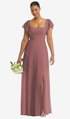 a woman in a long purple dress holding a bouquet