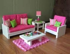 a living room with pink and green furniture