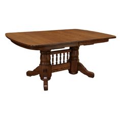 an oak dining table with spindles on the legs and a square wooden table top