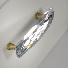 a close up of a door handle with a diamond on it