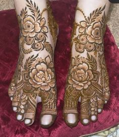 the feet are decorated with henna and flowers