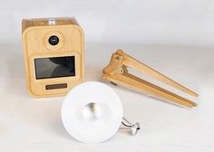 an old fashioned wooden projector and some other items