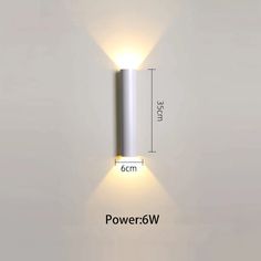 an image of a wall light that is on the side of a white wall with measurements