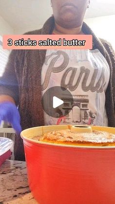 a woman standing in front of a red bowl filled with food and the words, 3 sticks salted butter