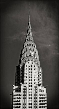 the top of a tall building with many windows