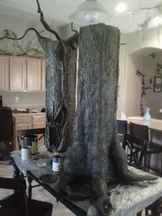 a couple of tall trees sitting on top of a table