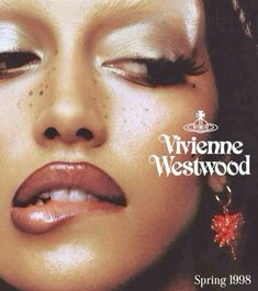 an advertisement for viviene westwood featuring a woman's face with her eyes closed