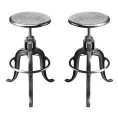 two metal stools sitting next to each other