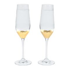 two champagne glasses with gold rims on white background