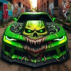 a green car with an evil face painted on it