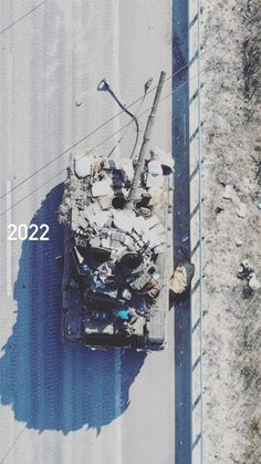 an aerial view of a tank on the ground