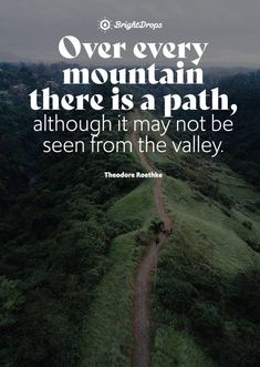 a dirt road in the middle of a lush green hillside with a quote from theodore roosevelt