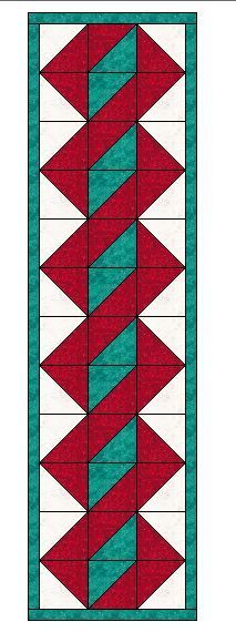 a red and green quilt with an arrow pattern on the bottom, in front of a white background