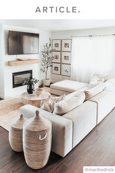 a living room filled with furniture and a flat screen tv mounted on the wall above a fire place