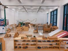 a room filled with lots of wooden toys