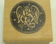 a wooden stamp with an angel on it