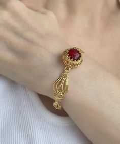 "Gold Ruby Vintage Silver Edwardian Bracelet, 925 Sterling Gold Plated Red Quartz Gemstone, Artisan Handmade Antique Filigree Bracelet Unique Women Jewelry, silver gift for her, victorian bracelet, wedding gift her, july birthstone, one of a kind Material: 925 Sterling Silver GOLD PLATED ( NICKEL FREE ) Gemstone: Ruby Quartz  12 mm. Ruby is the July birthstone - and it's one of the most coveted of gems. The name is derived from the Latin word ruber, meaning \"red\" - the color of love and passio Gold Ruby Jewelry With Filigree Detail, Vintage Red Jewelry With Jubilee Bracelet, Ornate Ruby Jewelry Gift, Ornate Ruby Gemstone Jewelry, Victorian Garnet Jewelry Gift, Victorian Rings Vintage, Red Ruby Bracelet, Red Gemstone Jewelry, Vintage Gold Bracelet