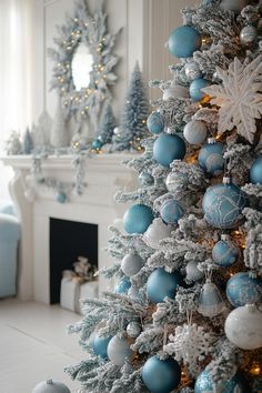 a decorated christmas tree with blue and silver ornaments