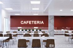 an empty cafeteria with tables and chairs in front of a sign that says cafetera