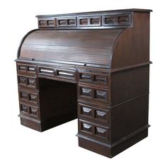 an old fashioned wooden desk with drawers