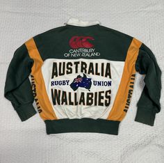 Please read all description carefully before buying. If you have any questions feel free to ask. Vintage 1990's Canterburry Australia Rugby Union Wallabies Colour : Green,yellow Size on tag : M  Brand : Canterbury  Condition : Good condition. A bit defect end of sleeve MEASUREMENT Armpit to armpit : 22" Shoulder to bottom hem : 22.5" PLEASE CHECK ACTUAL SIZE CAREFULLY, NO RETURNS OR COMPLAINT FOR WRONG SIZE ACTUAL. ACCEPT PAYPAL ONLY.  Shipping cost is $18 for economy or $28 DHL Express wordwide shipping. Transit time can take  2-3 weeks for economy and 3-5 business days by DHL Express to reach destination.  Please leave your phone number on the note while make a purchase, as the shipping company always need the phone number to help delivering.  This item will be ship along with Tracking N Rugby Tee, Rugby Vintage, Irish Rugby, Sleeve Measurement, Australia Rugby, Apparel Design Inspiration, Rugby Fashion, Rugby Union, Canterbury